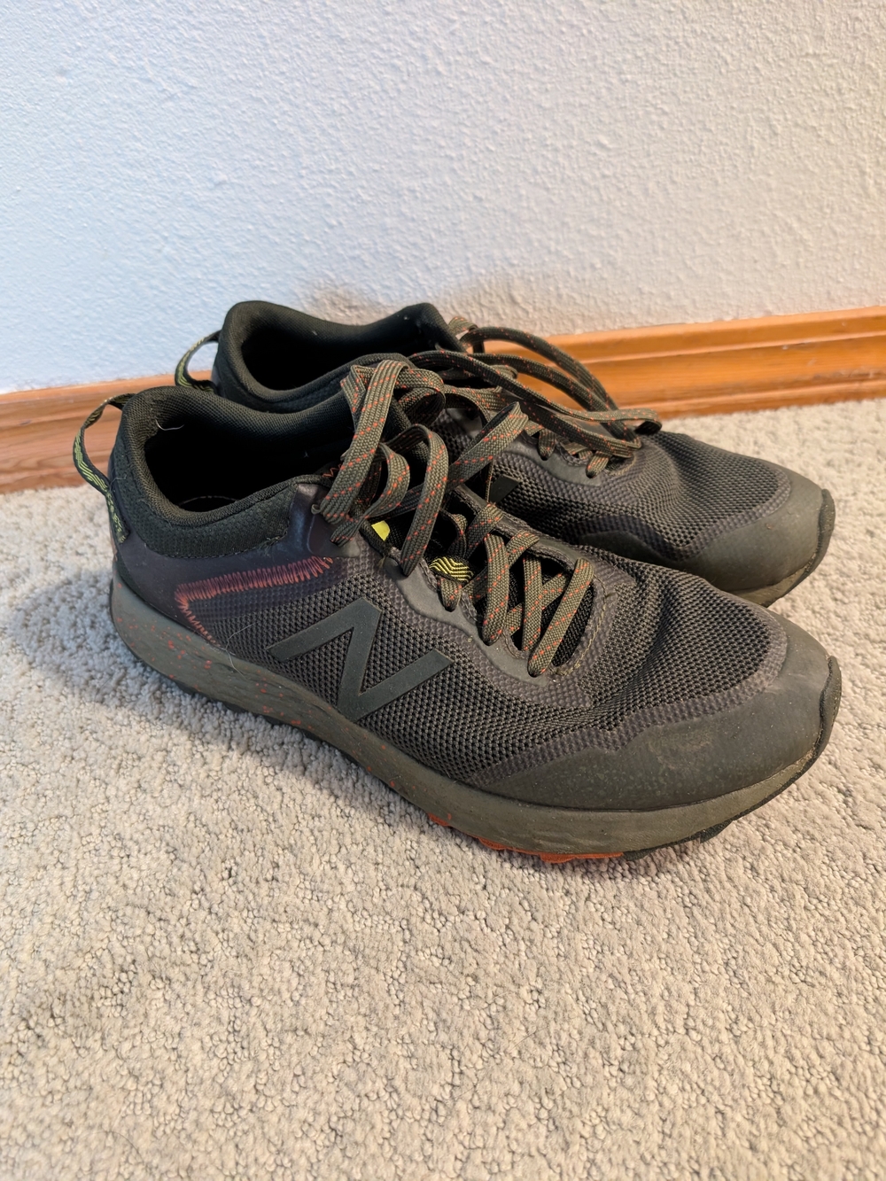 New Balance Men's Black Sneakers with Subtle Red and Green Accents